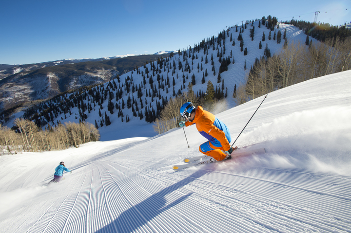 Family skiing down Fanny Hill in Snowmass during Winter
