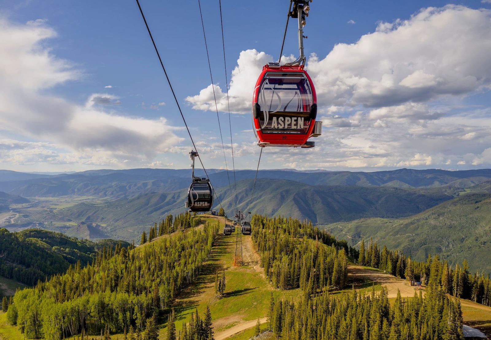 Silver Queen Gondola ride offering mountain views during summer in Aspen