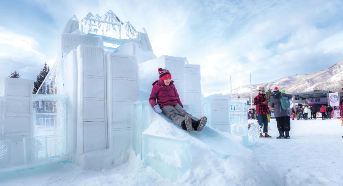 A child play in a castle made of snow during Christmas in Aspen